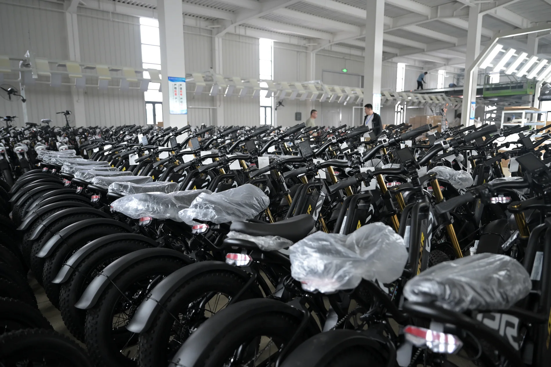 Rows of completed electric bikes at the factory